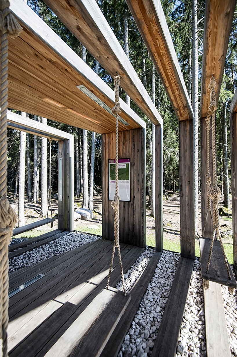 noa* builds swinging frames installation from wooden posts - 2