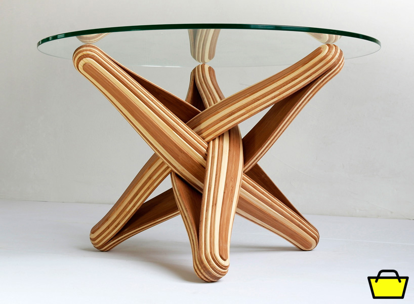 the table's frame is made from multiple layers of bamboo that have been