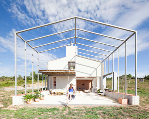 anna and eugeni bach attach large frame canopy to country home in spain