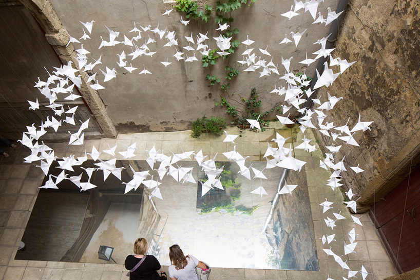flock of origami birds at the festival des architectures vives