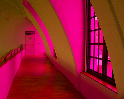 liz west bathes art deco building in yellow and hot pink hues