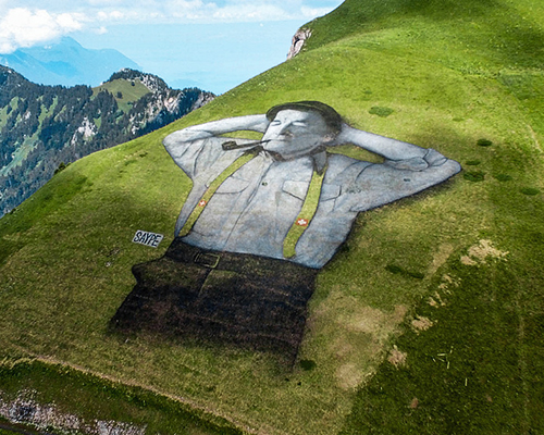 saype draws 10,000 square meter man in the mountains of leysin, switzerland