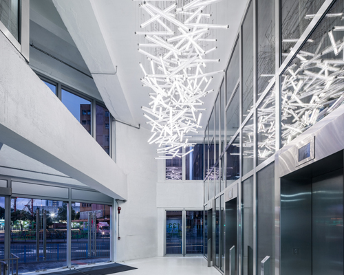 LASVIT concurrency chandelier hangs in MVRDV's hong kong glass offices
