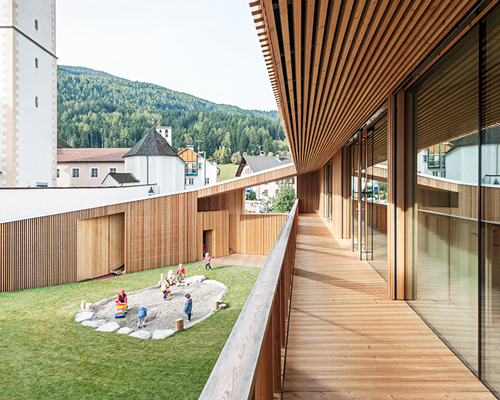 feld72 aligns wood-wrapped kindergarten to the village and landscape of south tyrol
