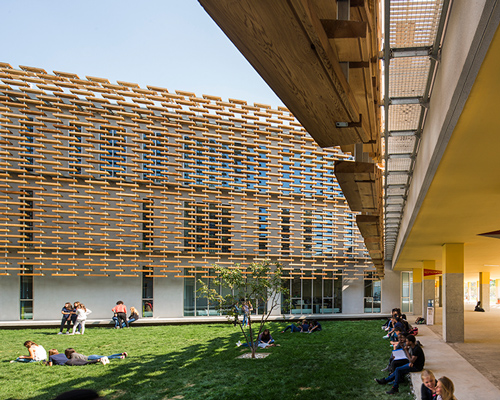 jacques ferrier wraps a wooden lattice around the french international school of beijing