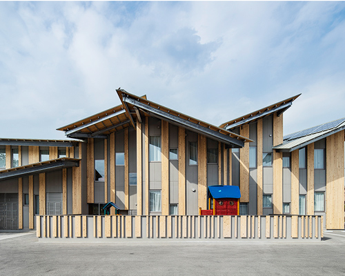 kengo kuma tops kindergarten in japan with multiple pitched roofs