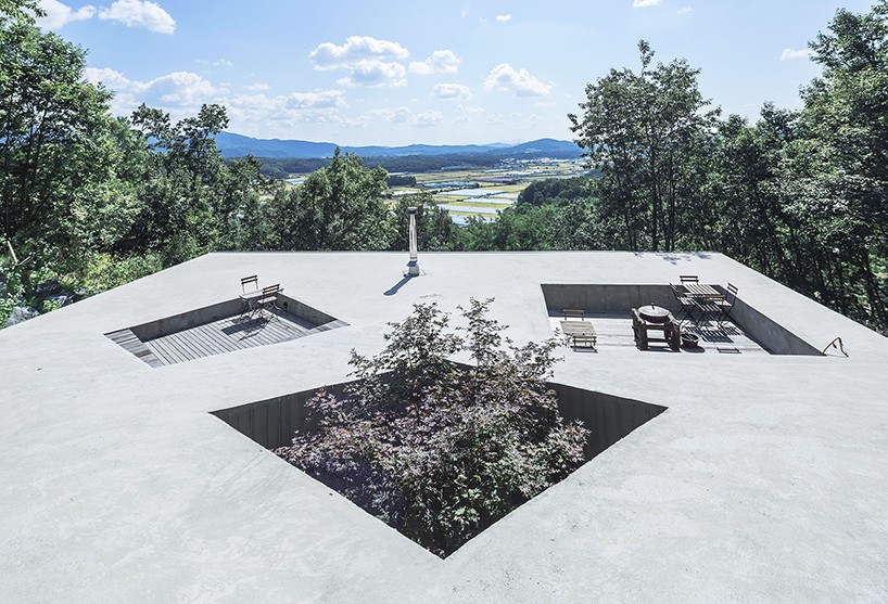 BCHO architects tilt roof house korea designboom