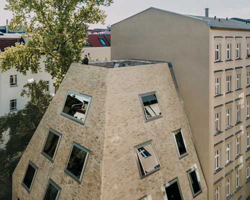 barkow leibinger builds a pyramidal brick residence in a berlin courtyard