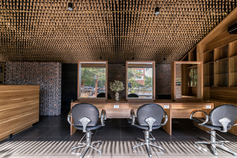 H&P architects install a ceiling of beads inside vietnamese hair salon