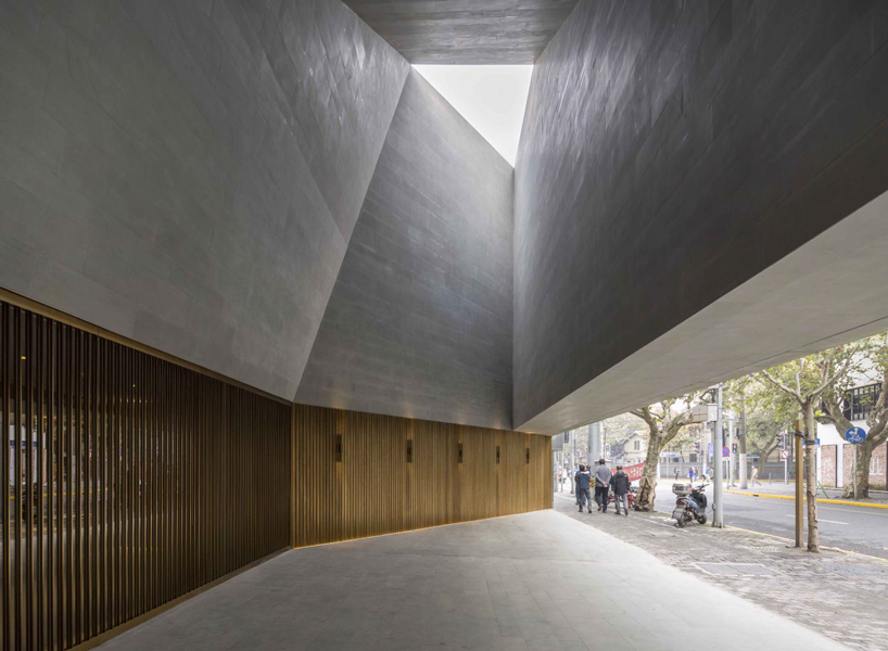 the design draws on the theatrical acts that take place inside, with ...
