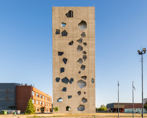morini arquitectos constructs concrete tower in argentina with irregular apertures