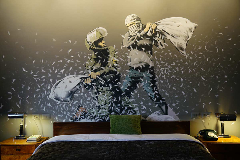 banksy opens 'the walled off' art hotel in bethlehem