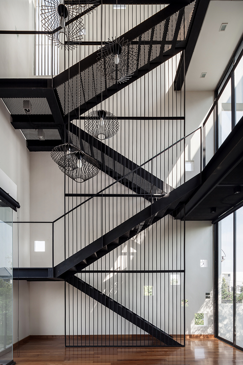 Stu D O architects carves openings throughout the fa ade Stu D O architects carves openings throughout the fa ade