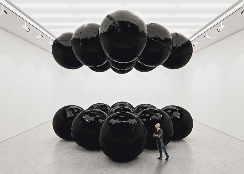 tadao cern's black balloon installation establishes a hypnotic balance