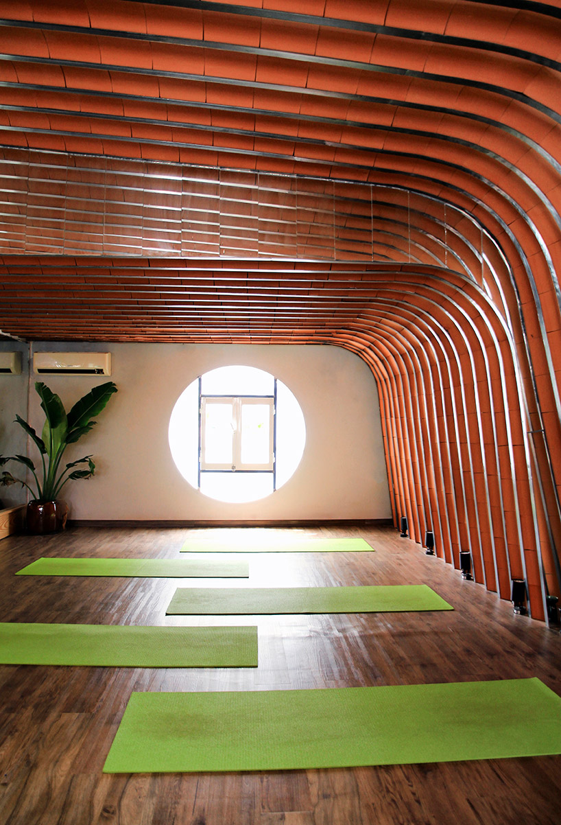 69.a StudiO clads yoga studio interior in vietnam with yin-yang tiles