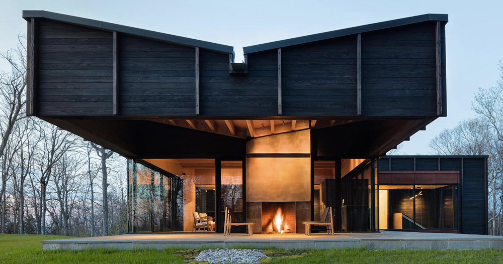 Form design idea #394: desai chia unites three offset structures to form charred timber lake house in michigan