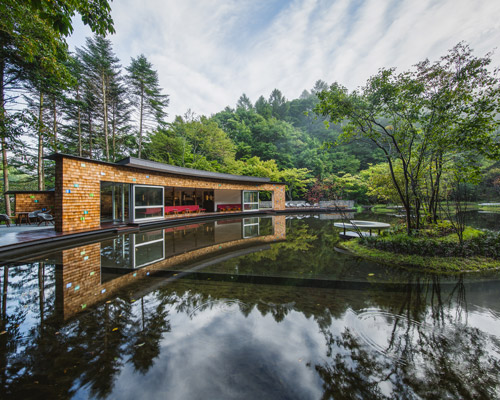 klein dytham's japanese picchio centre + ice rink resembles sweeping arcs made by skates