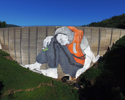 ella & pitr's tired giant transforms abandoned dam wall into artistic canvas in france