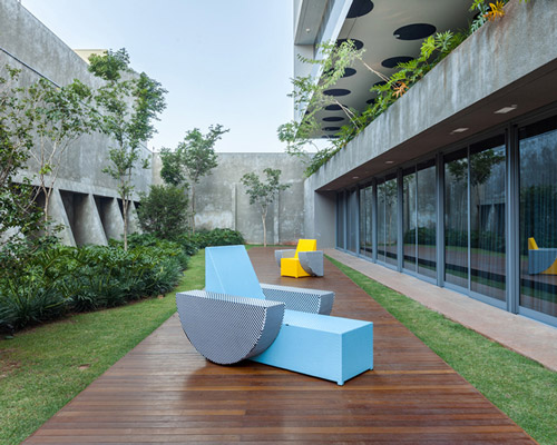sporadically scattered objects adorn form bureau's fine arts high school in sao paulo