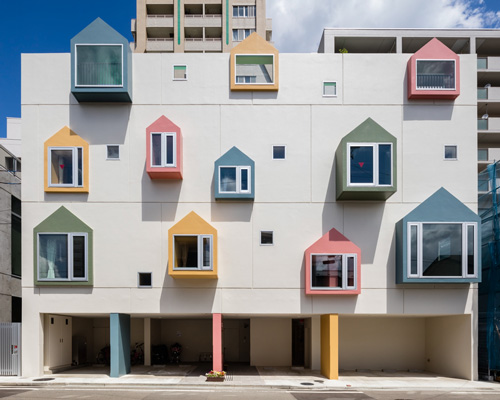 japanese nursery school welcomes students into creative learning space with colorful façade