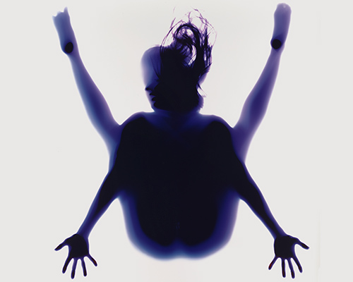 yoga photograms hauntingly highlight the human body's poised postures and positions