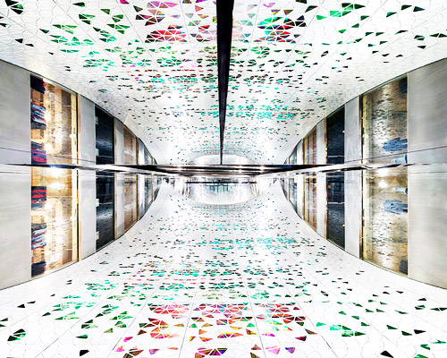 geometric veil echoes art nouveau with colourful mirror facade in parisian store printemps