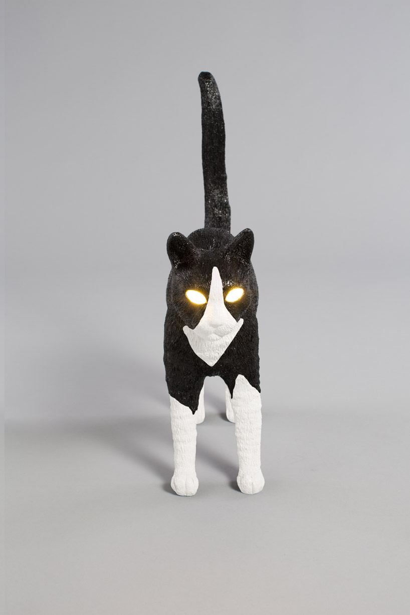 studio job's cat-shaped lamp for seletti has eyes that light up designboom