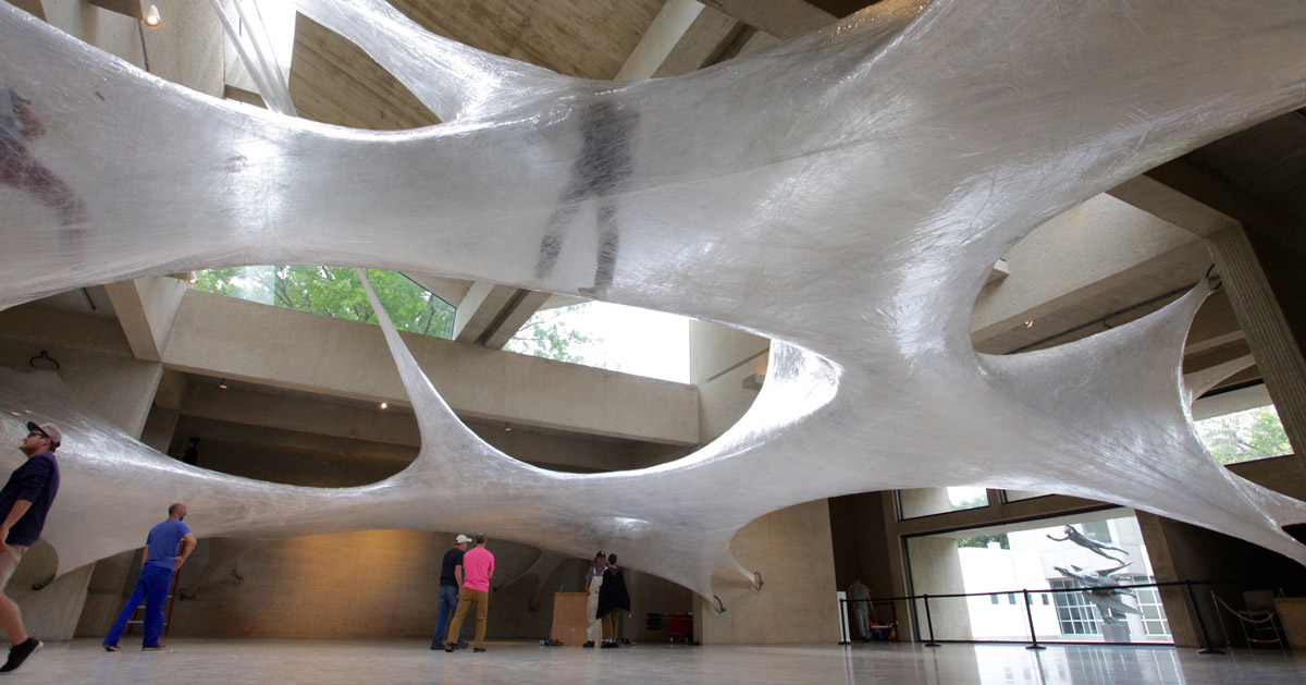 climb into this massive parasiticlike tape sculpture by numen/ for use