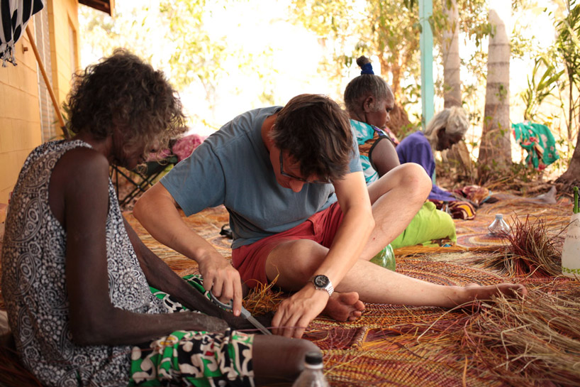 alvaro catalán de ocón working with weavers on the techniques to create the lamps