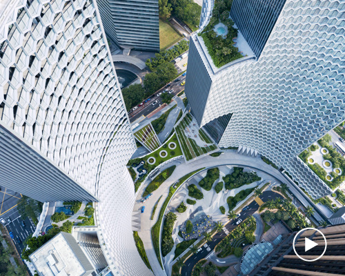 ole scheeren clads sculptural DUO towers in singapore with honeycomb shading system
