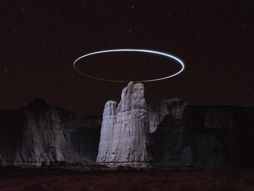 bakke lokal gidsel drone light paths above mountains captured in long exposure photography