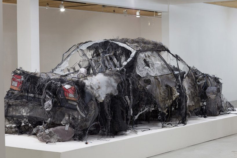 full-scale demolished car constructed from ghost-like textiles by jannick deslauriers