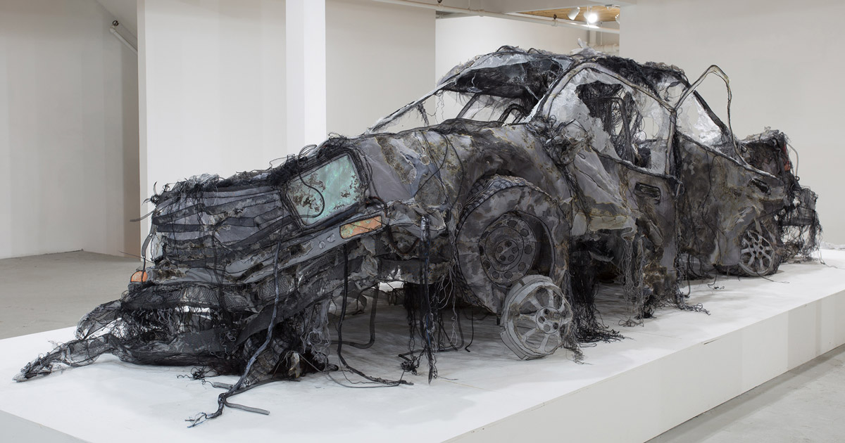 this full-scale demolished car is constructed from ghost-like