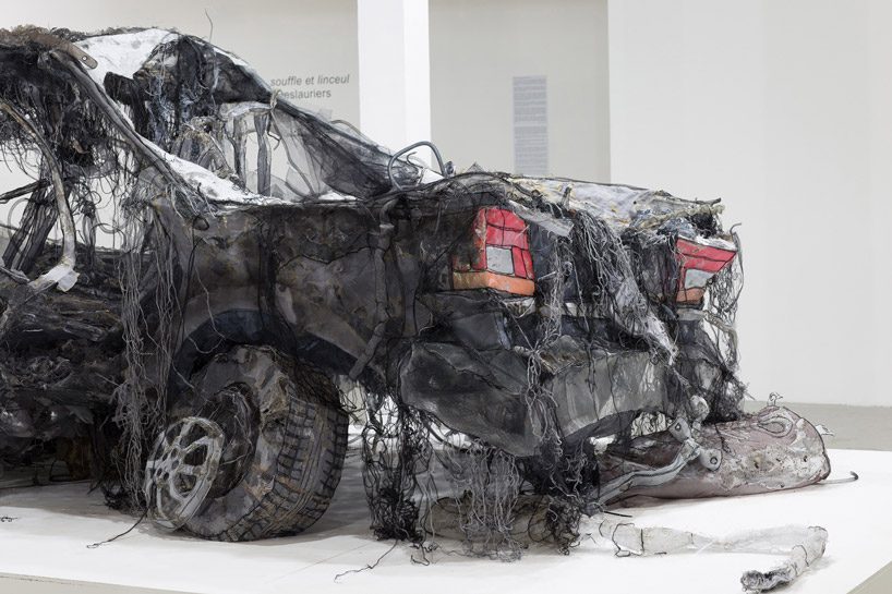 full-scale demolished car constructed from ghost-like textiles by jannick deslauriers
