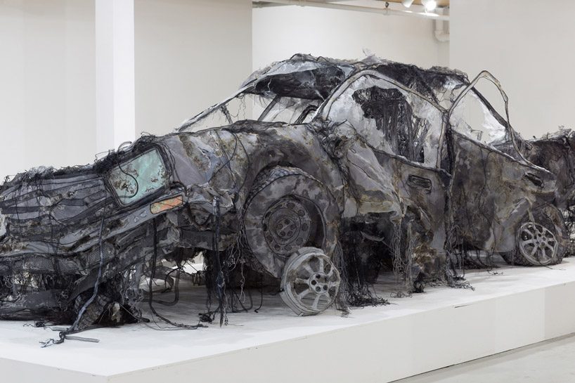full-scale demolished car constructed from ghost-like textiles by jannick deslauriers