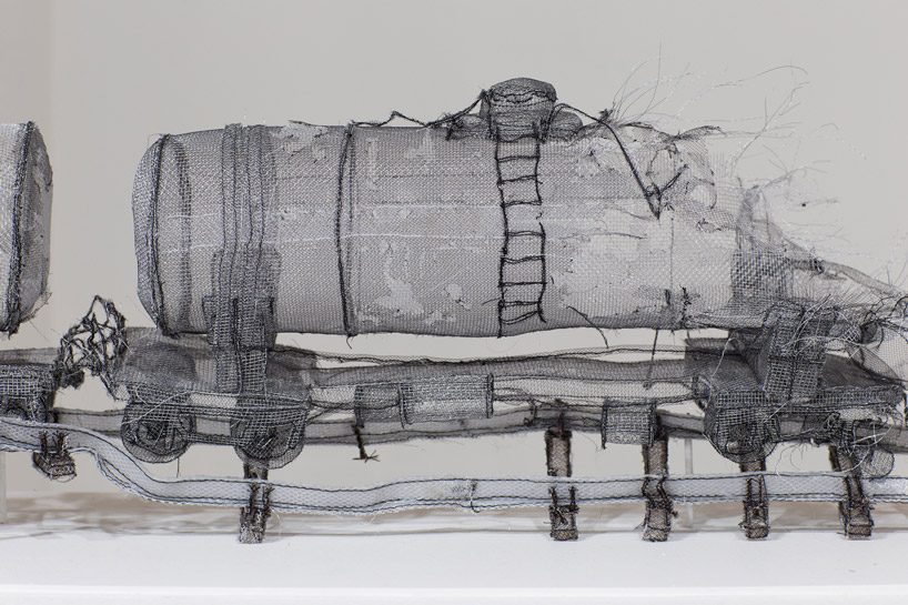 full-scale demolished car constructed from ghost-like textiles by jannick deslauriers