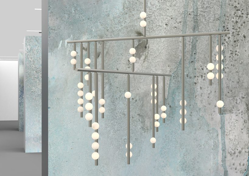 lindsey adelman's drop lighting system balances hand-blown globes on brass tubes