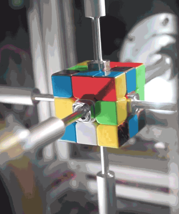 watch this robot solve a rubik's cube in under a second
