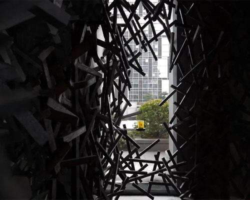 dim interior of infinity nide's café in china contrasts with bustling urban scene