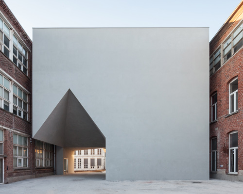 all-white building by aires mateus unites architecture school in belgium