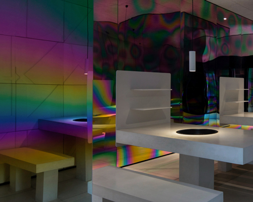 iridescent diner by infinity nide features colored, electroplated steel and white concrete