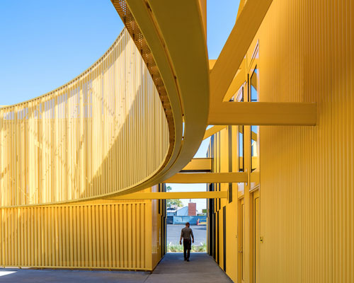 brooks + scarpa designs curved yellow charter school in south los angeles