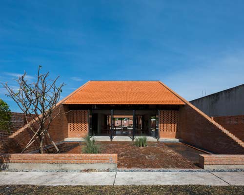 'long an house' in vietnam is a creative brick residence by tropical space