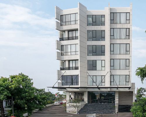 RAW architecture designs a wickering concrete rivoli hotel in the crowded east jakarta