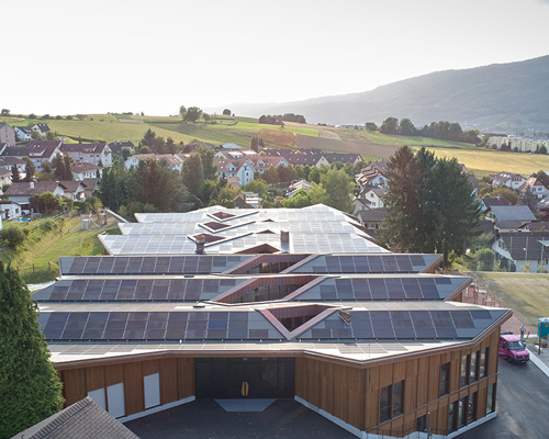 skop's self-sufficient school in switzerland also provides energy for 50 households