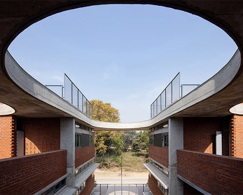 shaily gupta's school in india features brick blocks connected by a floating concrete roof