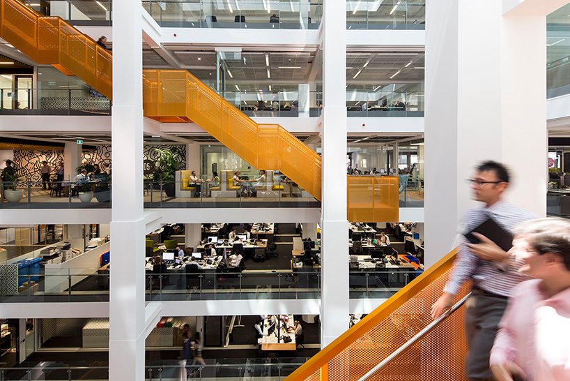 an orange staircase weaves the floors of this australian workspace together, by BVN + clive wilkinson