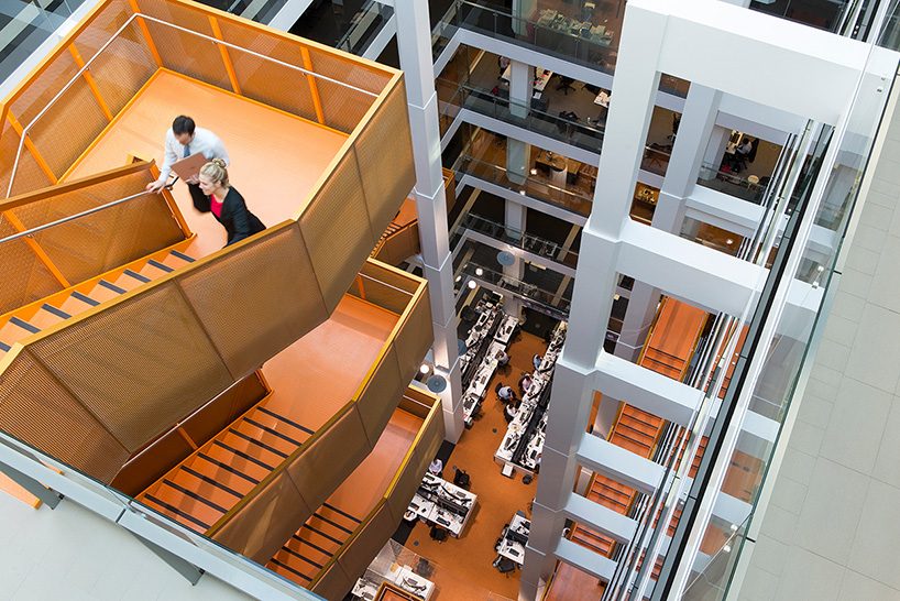 an orange staircase weaves the floors of this australian workspace together, by BVN + clive wilkinson