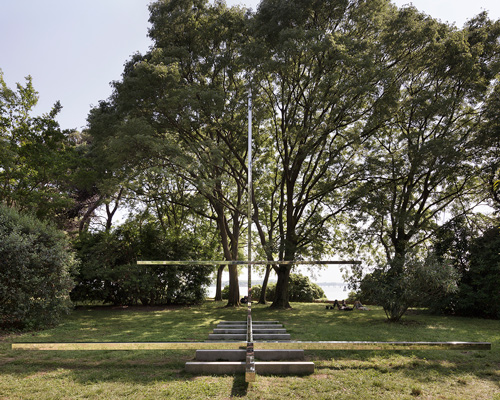 carla juaçaba's vatican chapel disappears into its bucolic setting at the venice biennale