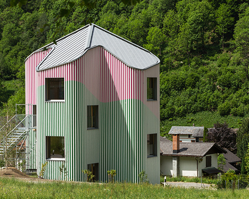 colorful swiss house rossa expresses a playfully artful structure in the calanca valley